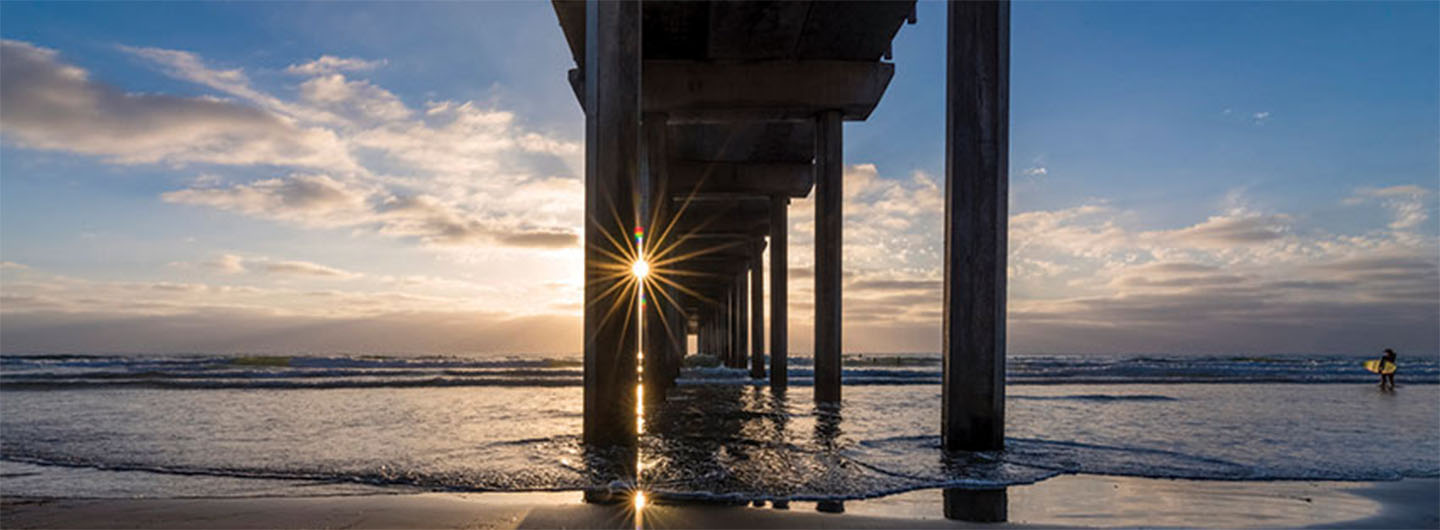 Scripps Pier with sunlight bursting through